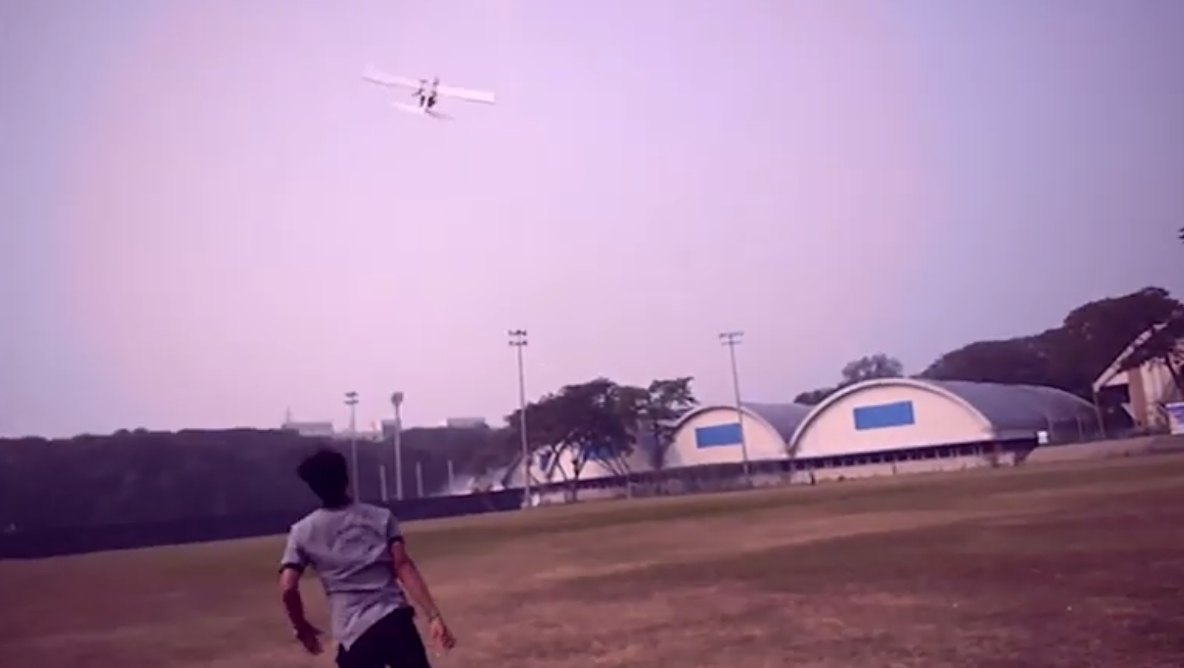 The 2019 aircraft in flight over the field