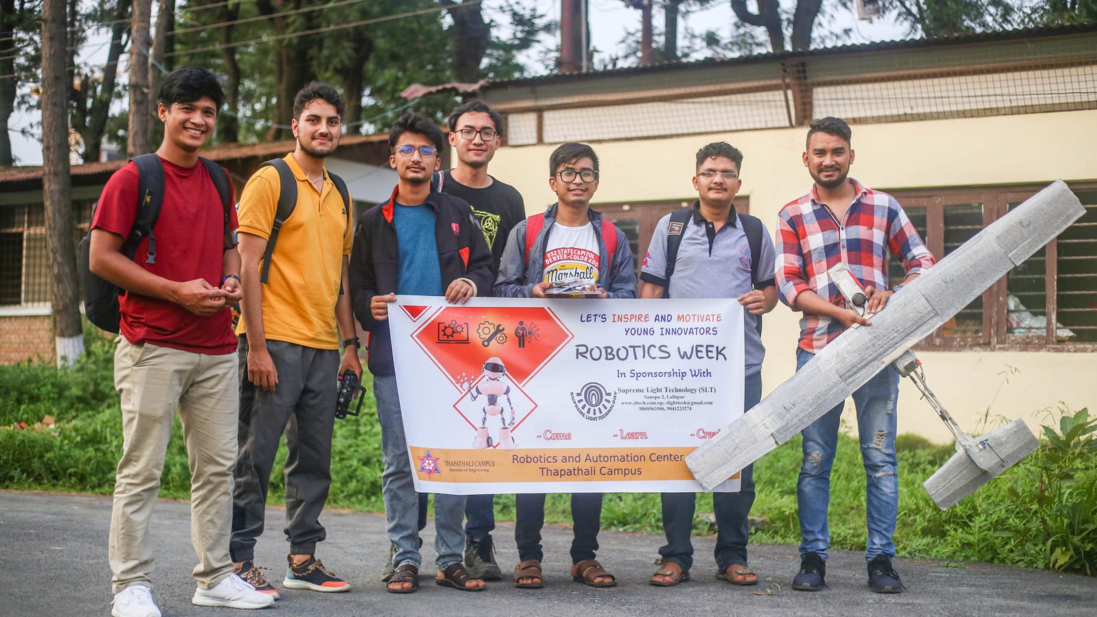 The 2019 team with their banner and aircraft