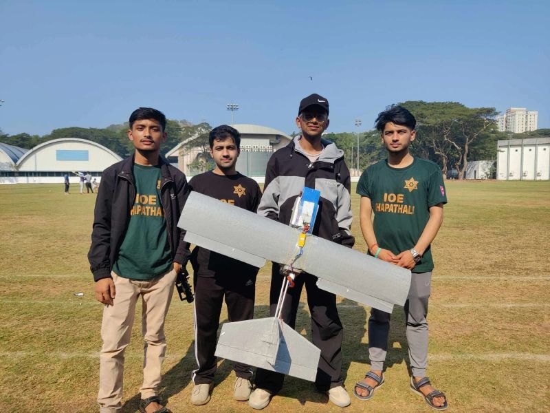 The 2023 team holding their aircraft at IIT Bombay