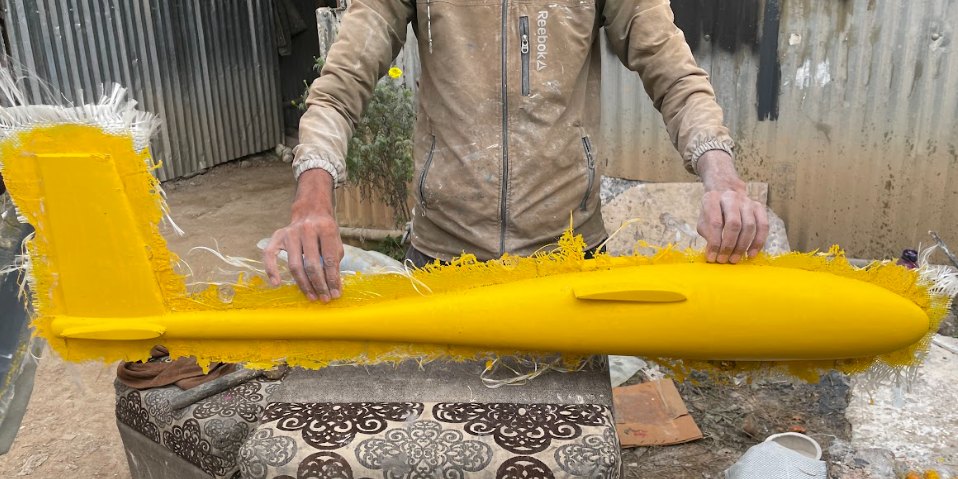 Yellow glass-fibre monocoque fuselage taken out of the mold