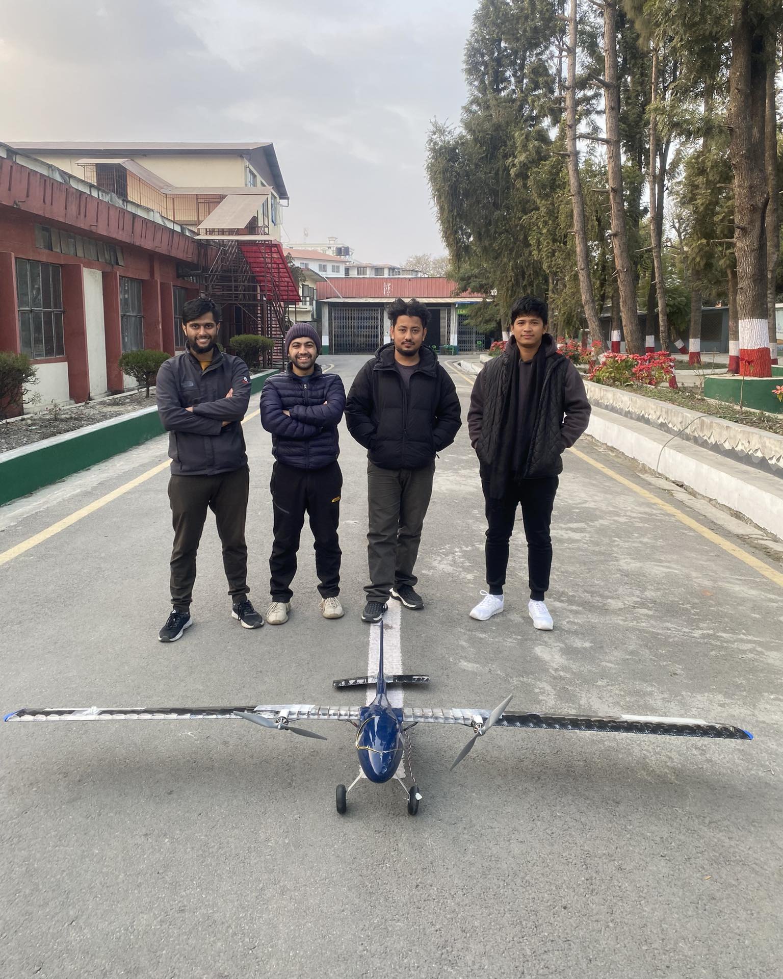 The team standing behind the finished 3 m wingspan RC aircraft
