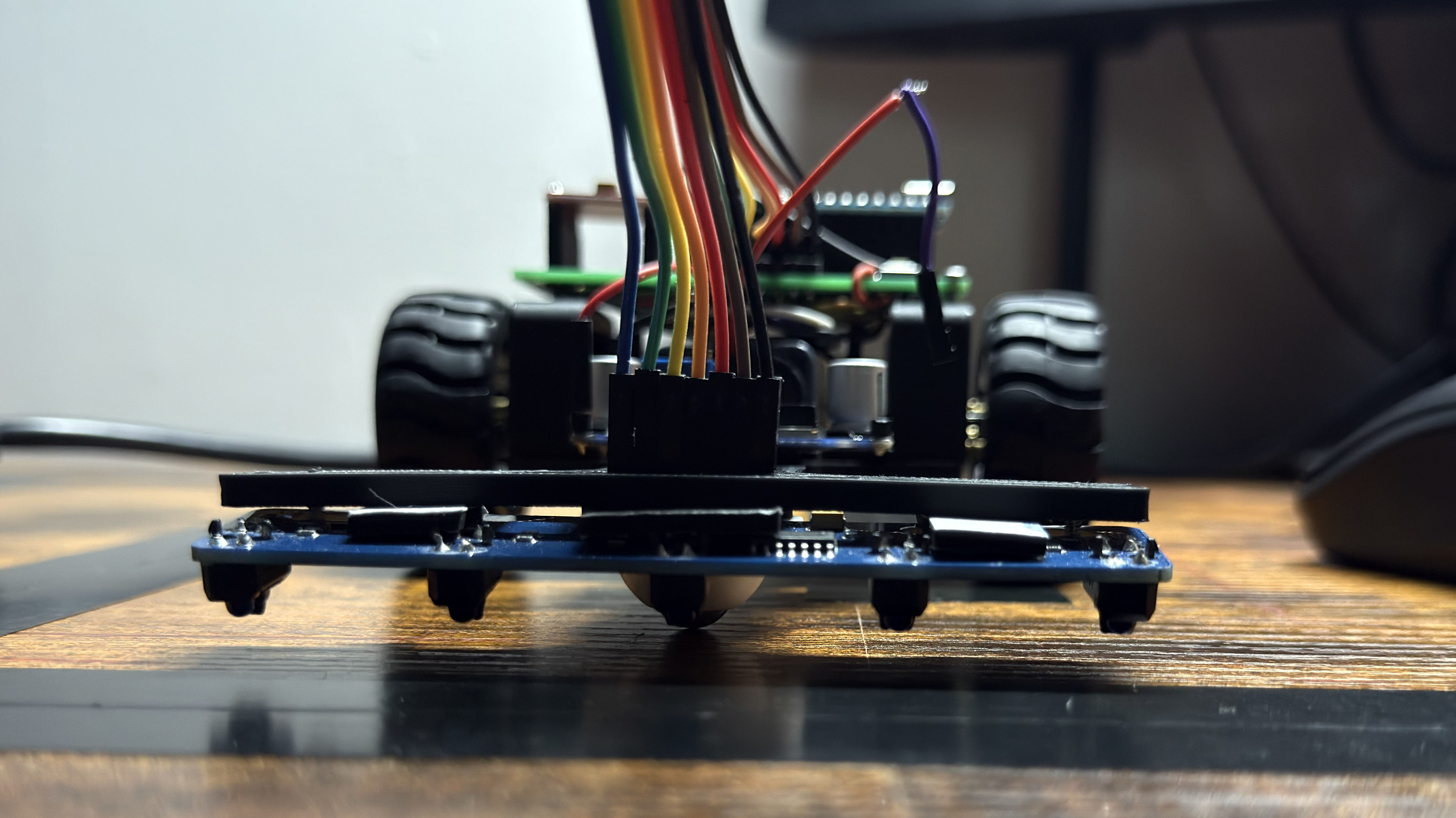 Close-up of the 5-channel IR sensor array mounted at the front of the chassis